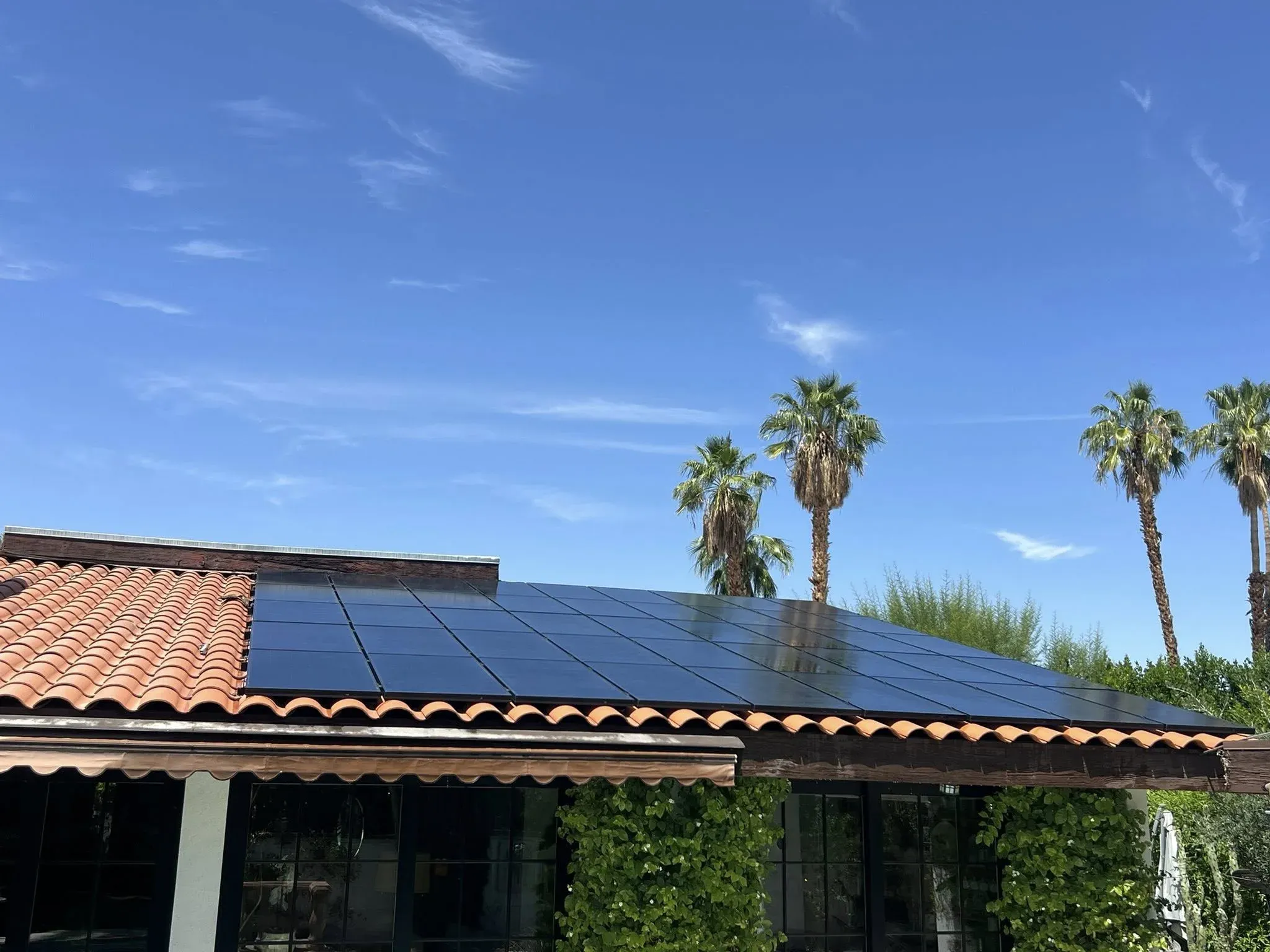 The same rooftop solar array clean and reflective after a DronePower1 drone cleaning pass