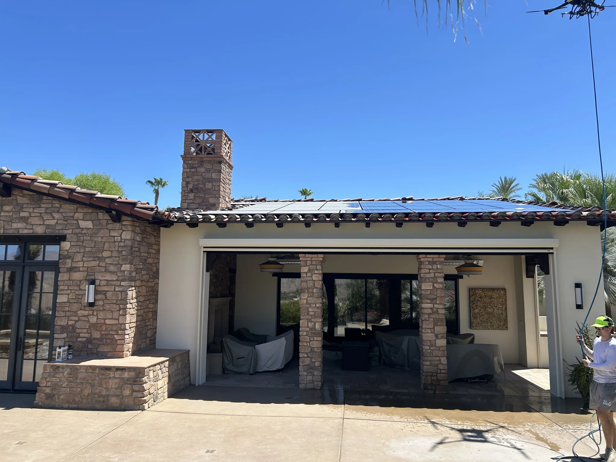 DronePower1 cleaning a tile-roof solar array in the Coachella Valley