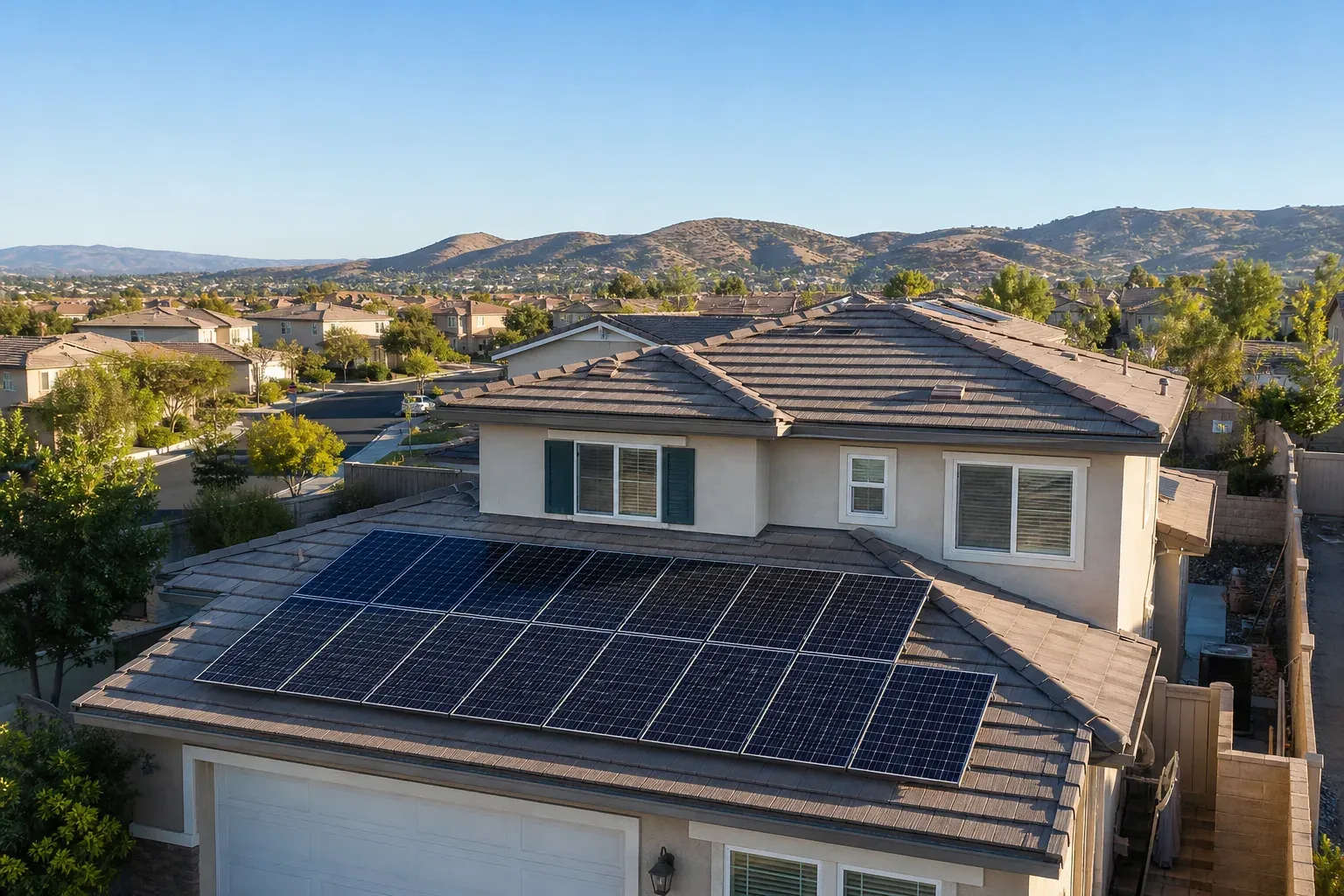 Rooftop solar on a Murrieta home with tile-roof neighborhoods and dry foothills beyond.