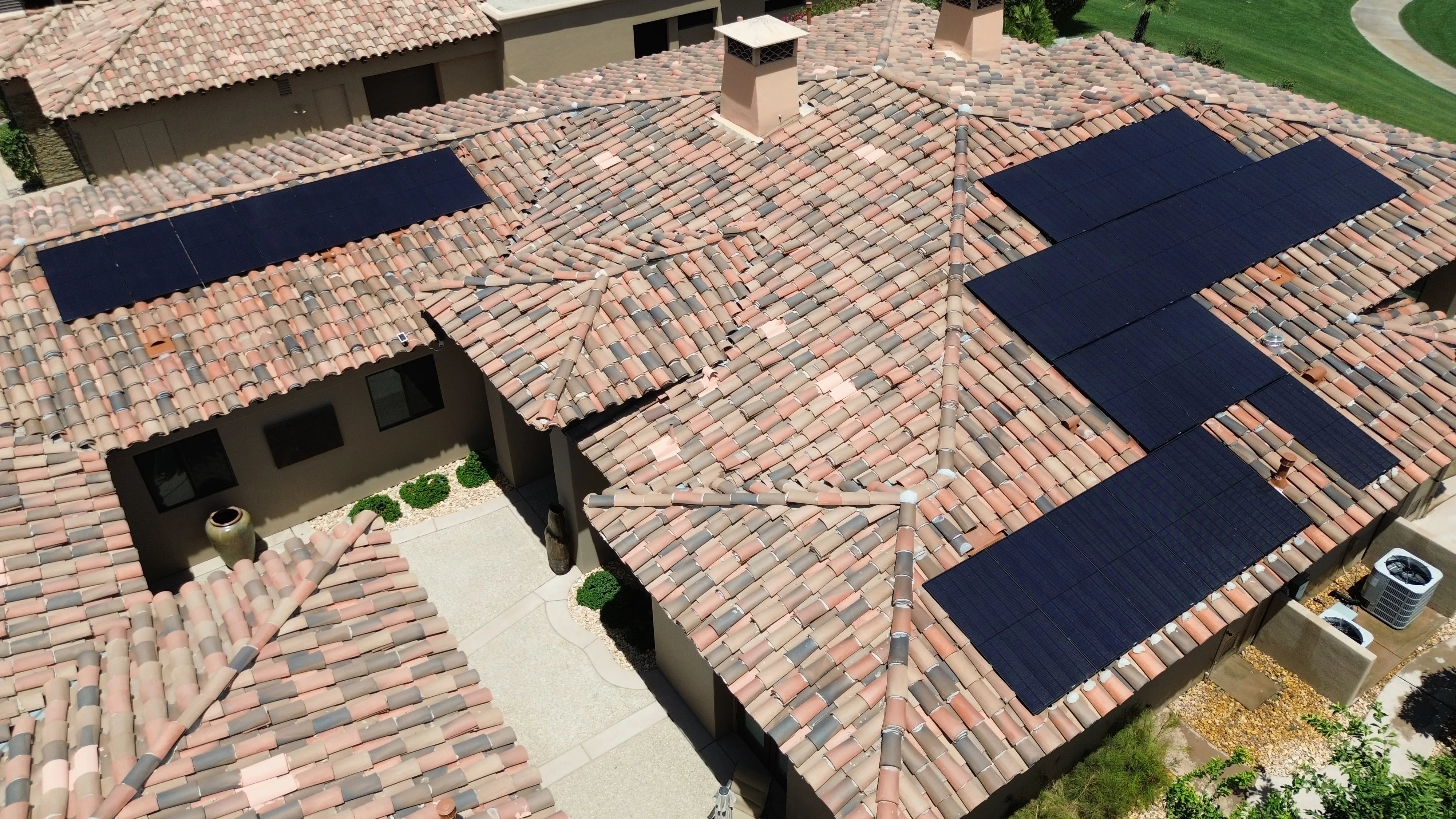 Overhead aerial view of a large rooftop solar array