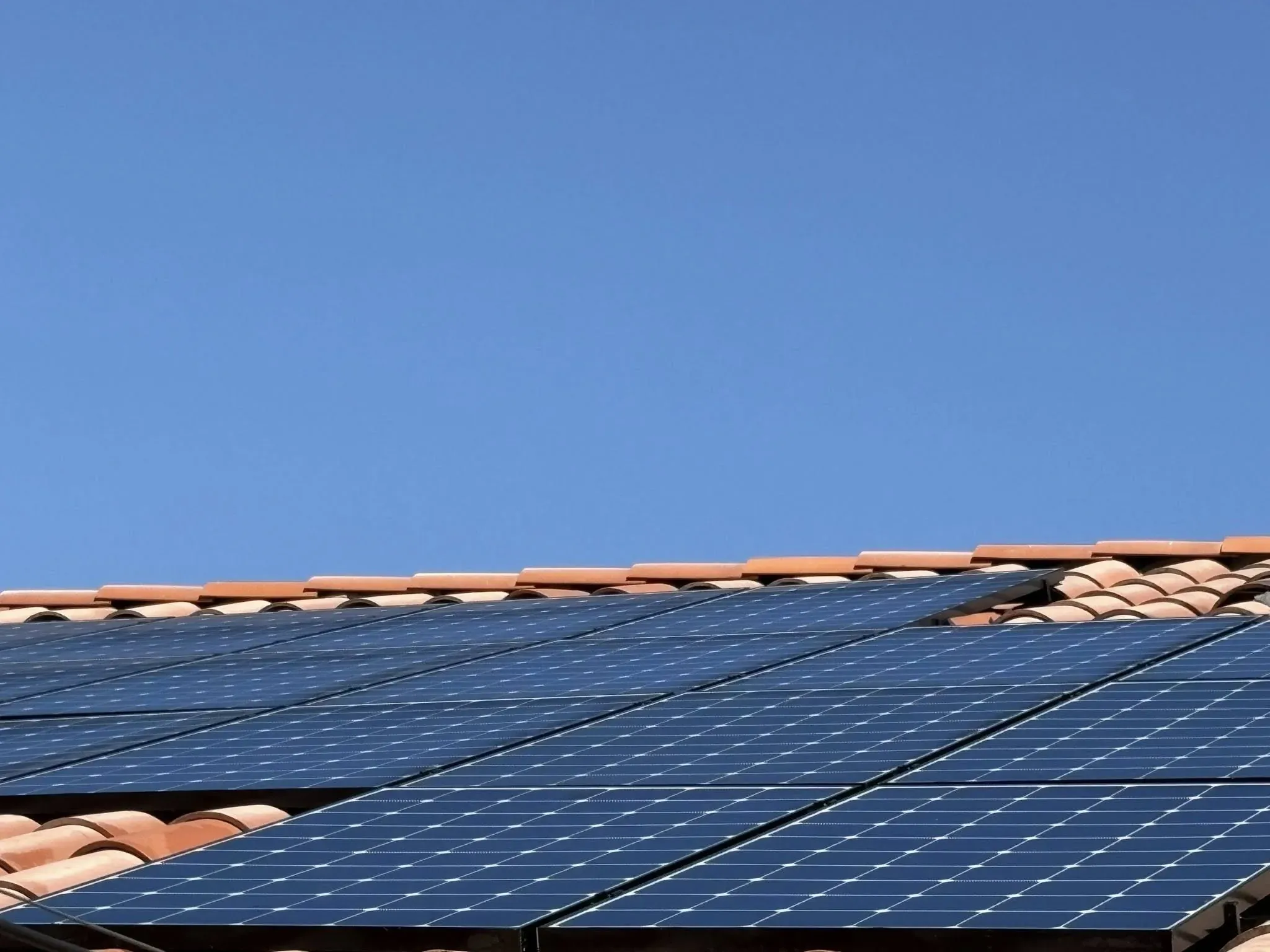 Roof-level solar detail showing strong, clean panel lines