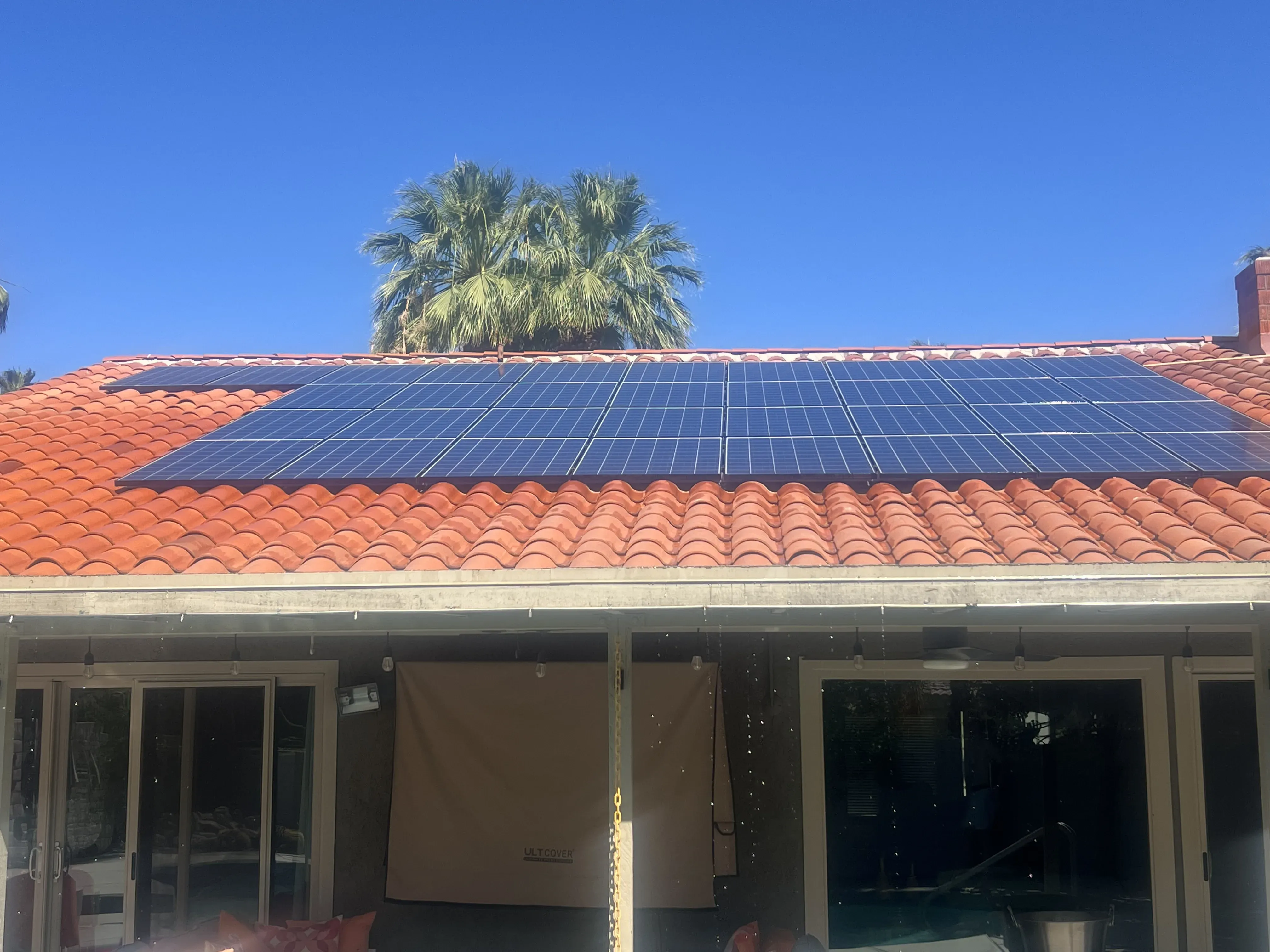 Front-facing view of a home with a rooftop solar array installed
