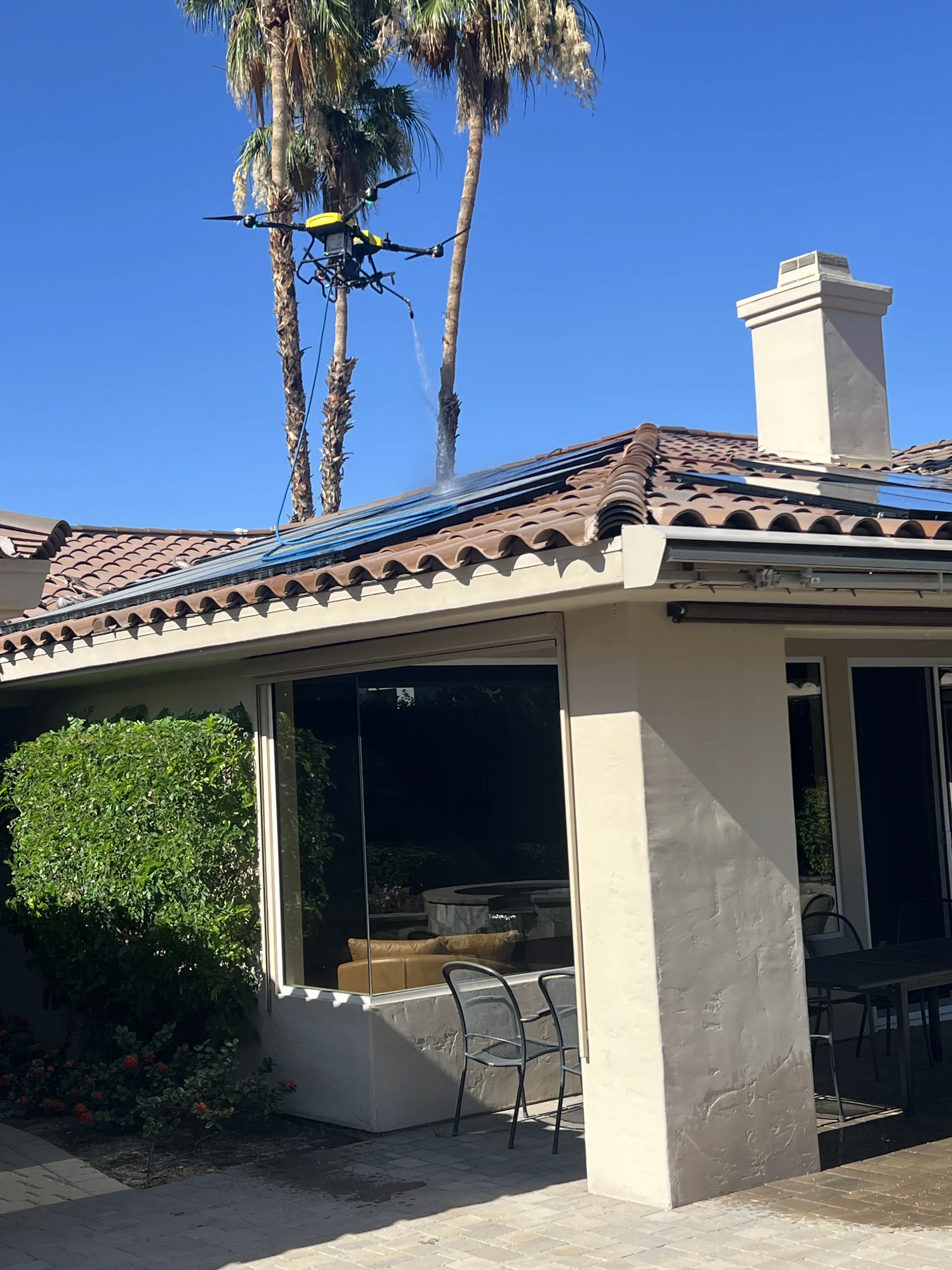 Low side-angle view of a roof with dark solar panels showing the pitch and panel line