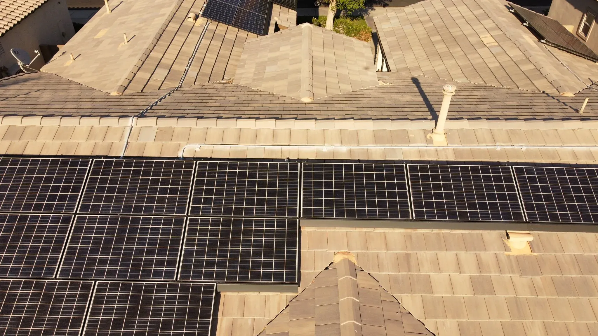 Wide overhead view of a roof with a solar array installed