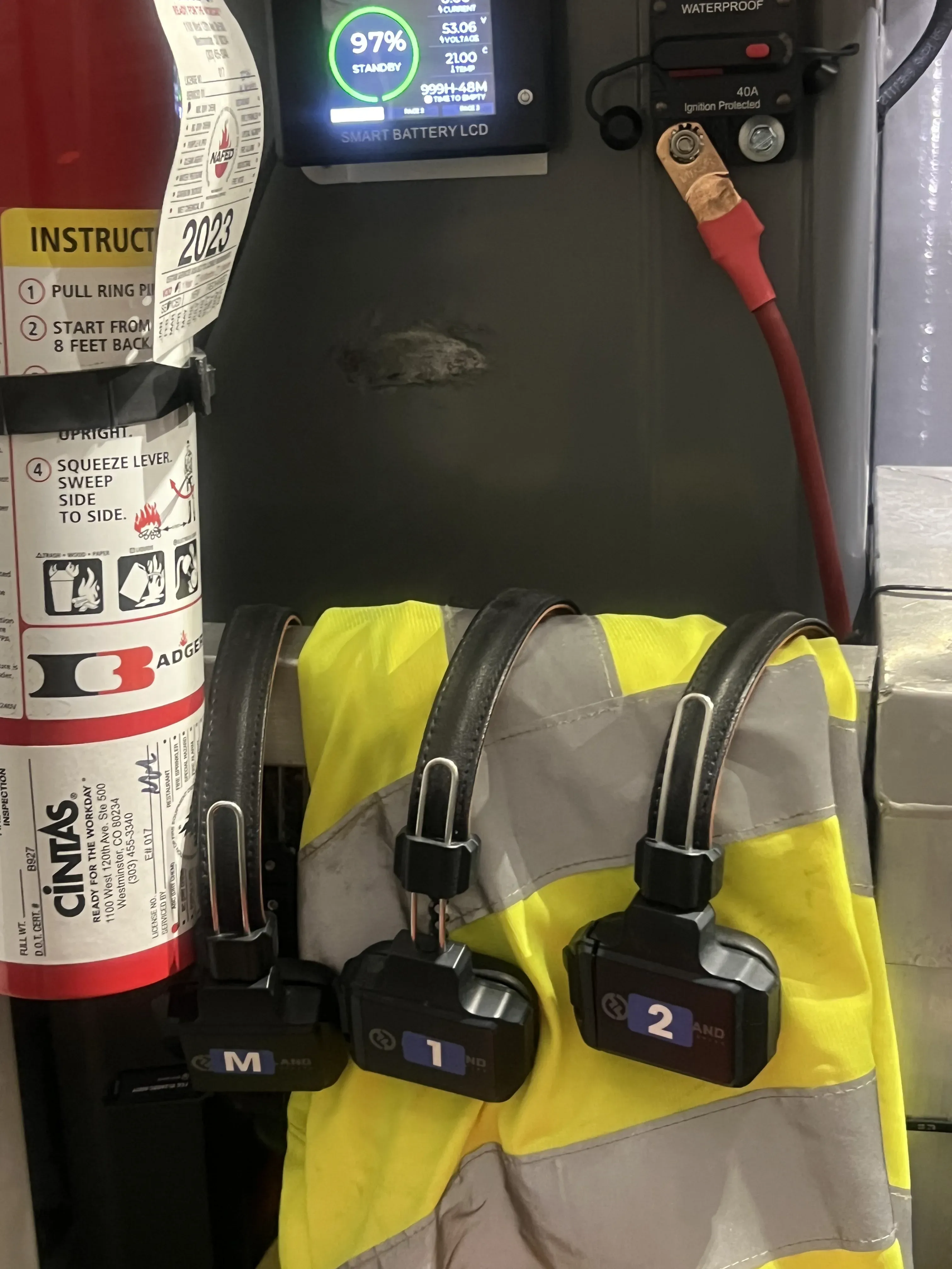 Climbing-style safety harness staged near the work vehicle before a cleaning job