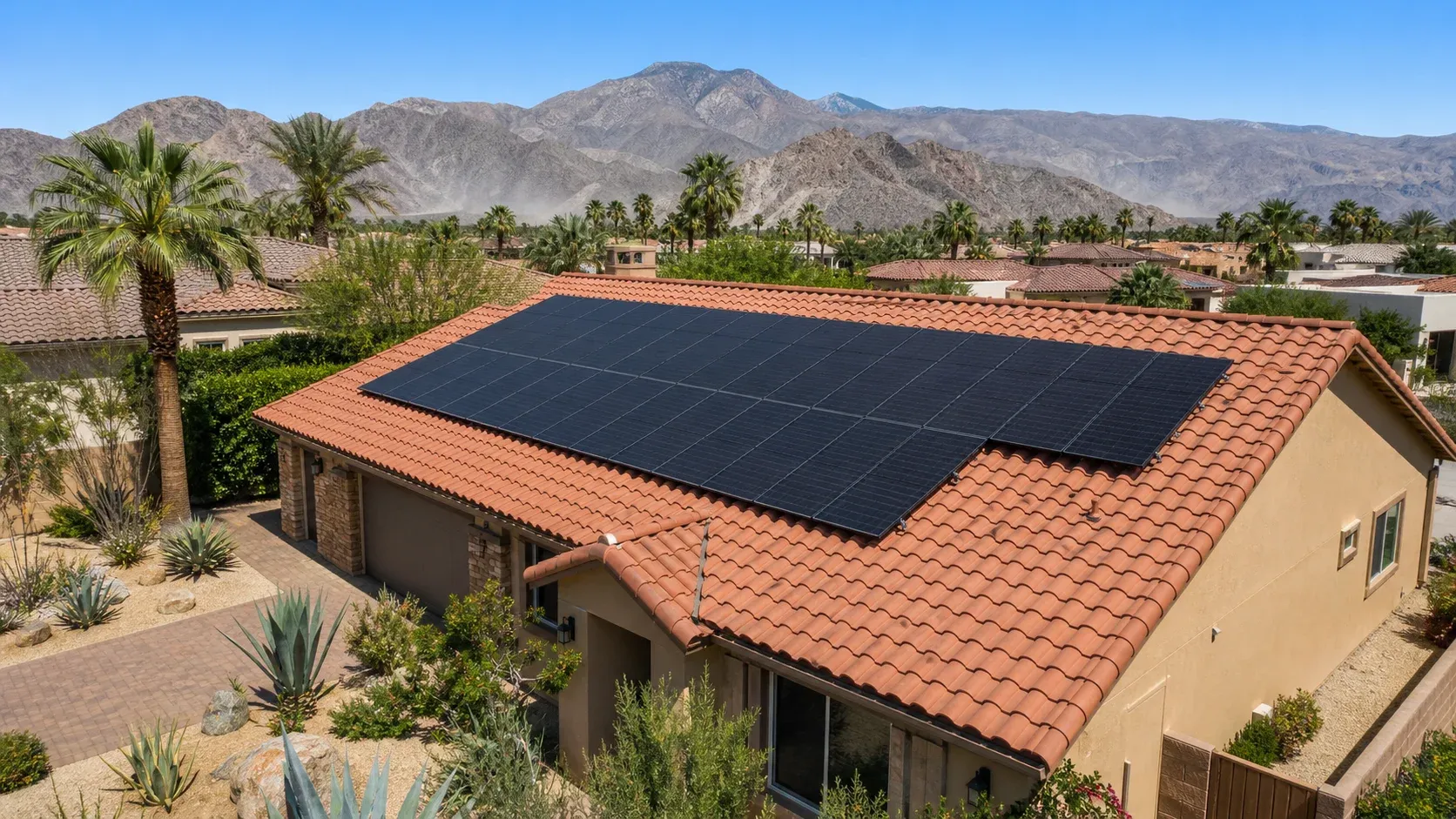 Representative Coachella Valley solar home with desert mountains and palm-lined neighborhoods