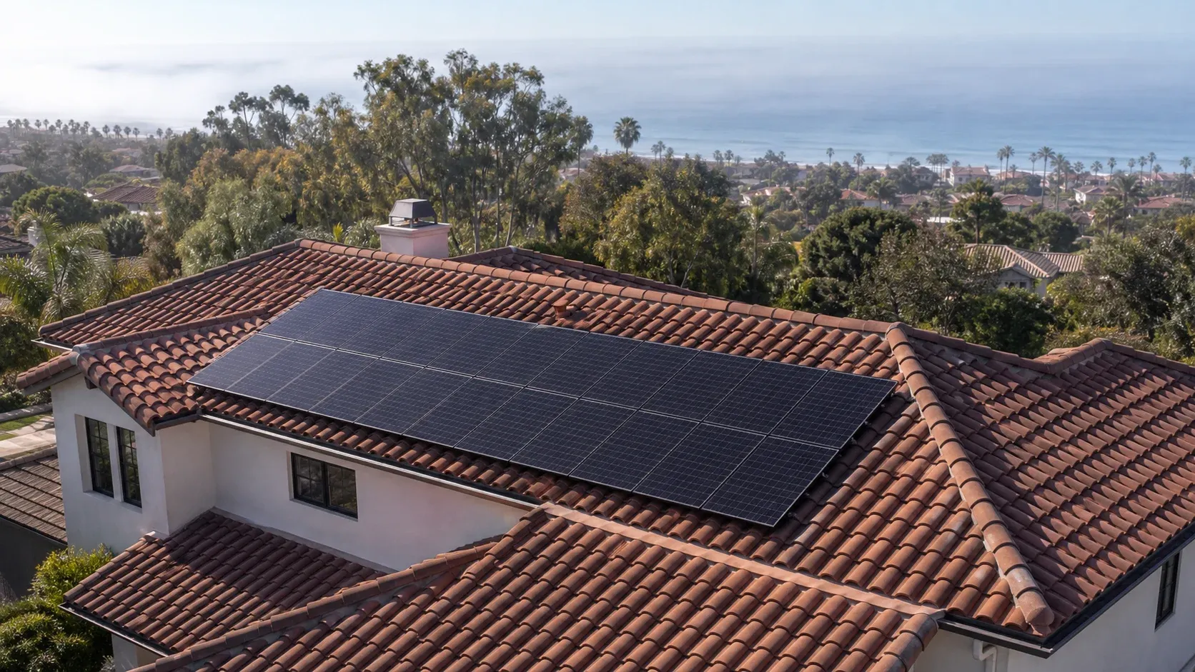 Representative North County San Diego solar home with a coastal neighborhood in the distance
